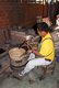 Thailand: Beating a heated silver bowl, Wualai Road, Chiang Mai, northern Thailand
